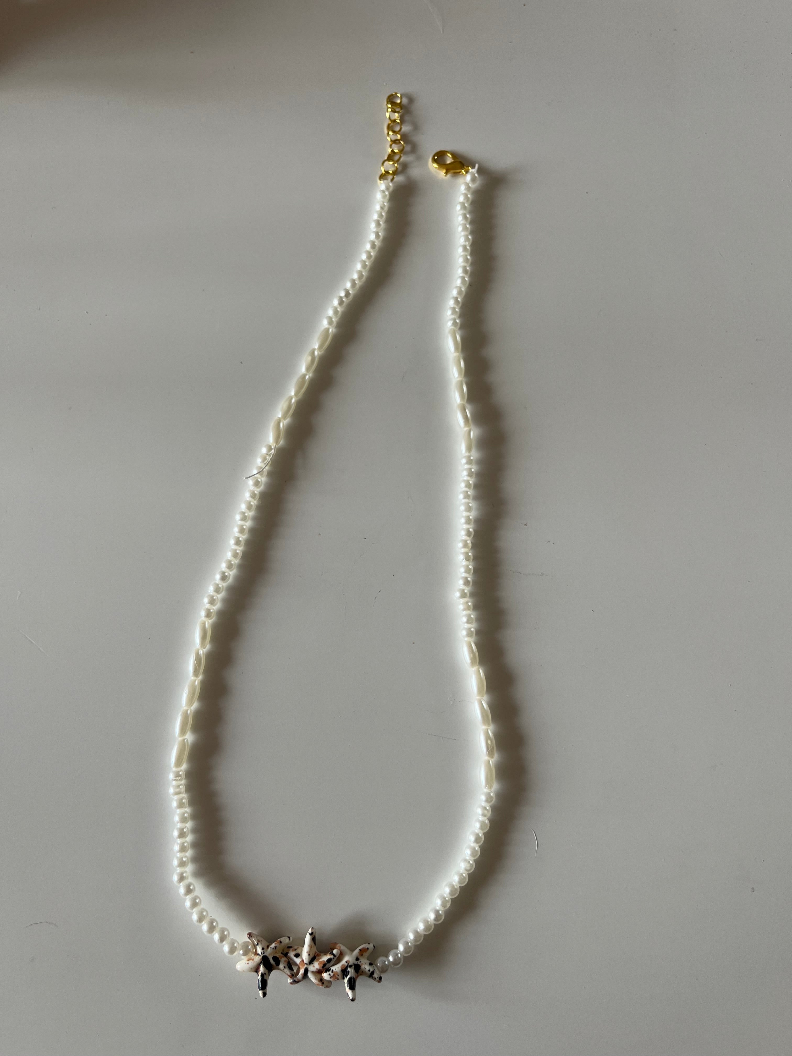 Colgante fino con estrellas de Mar